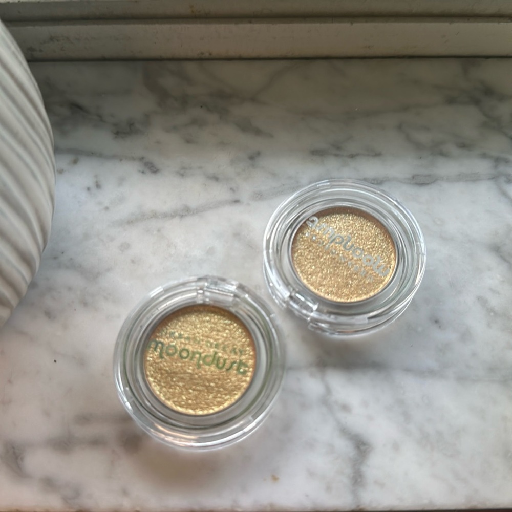 Two urban decay moondust eye shadow Fool’s gold color